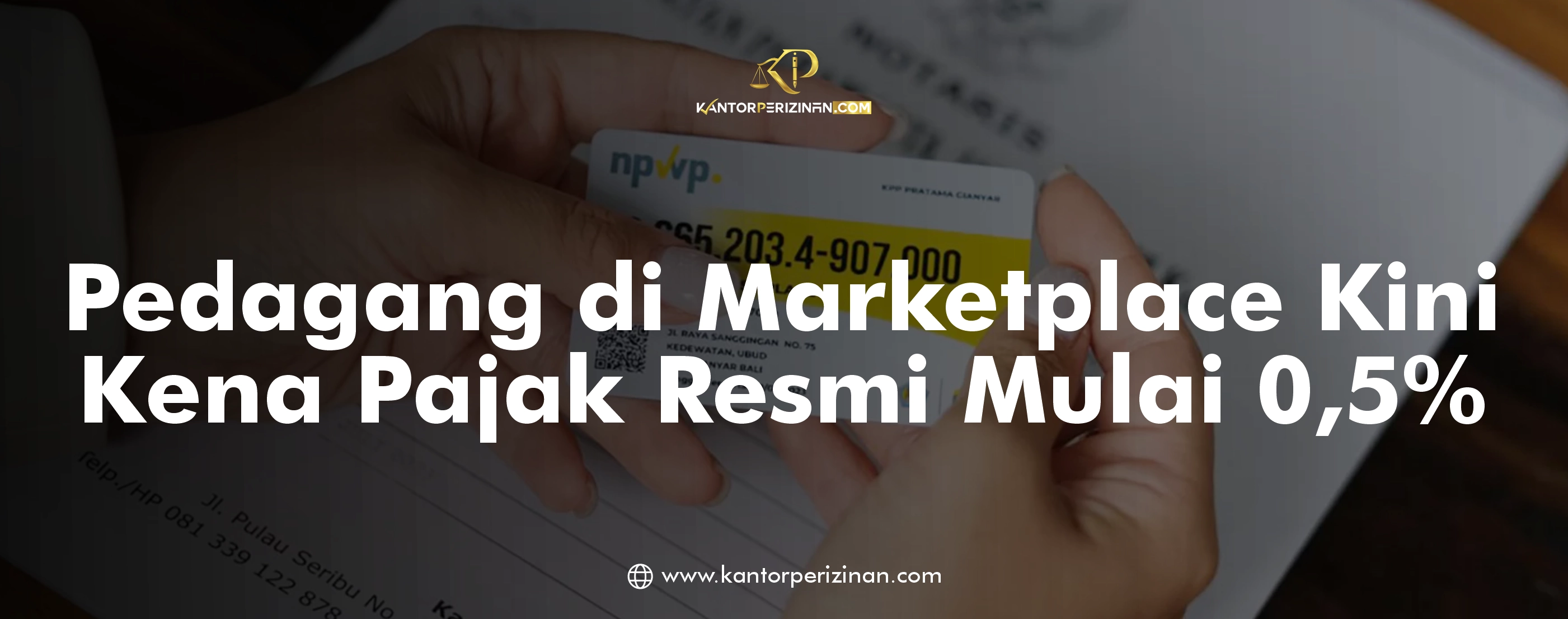 Hands holding documents and a phone on a wooden table